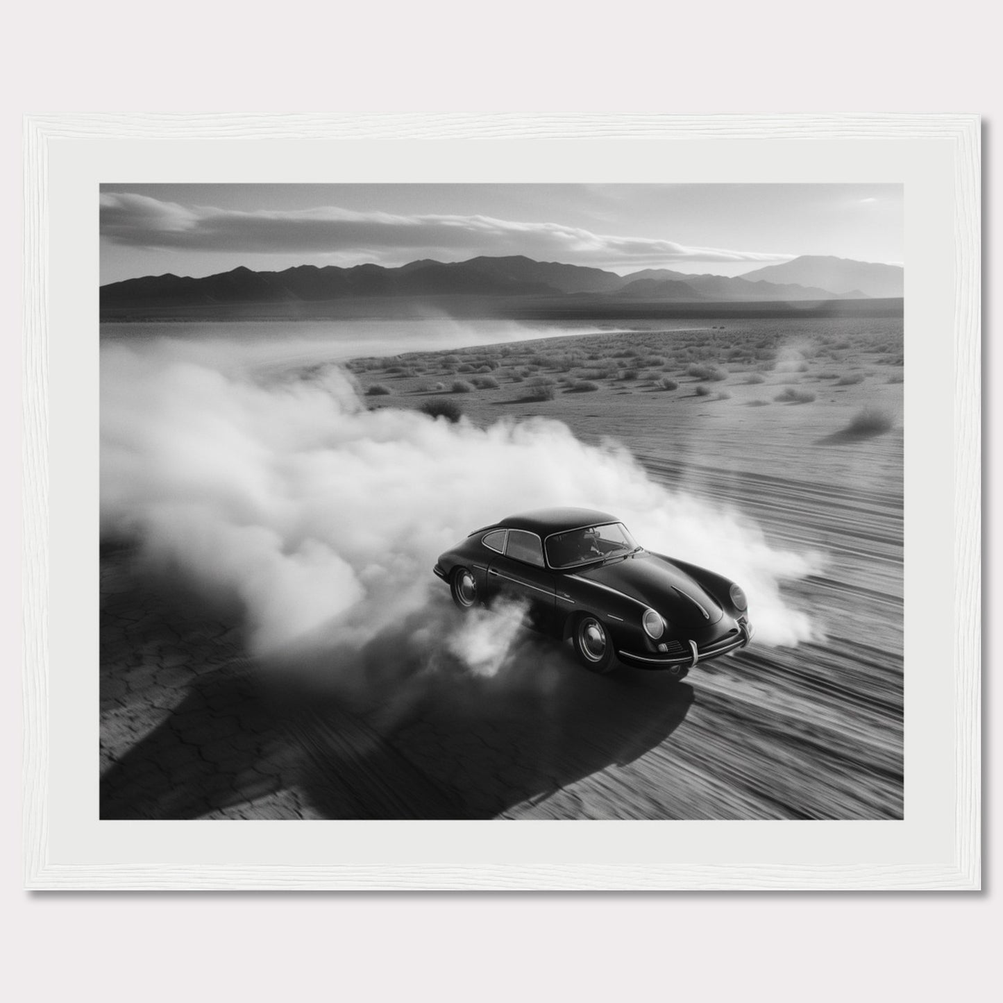 This striking black and white photograph captures a classic car speeding through a desert landscape, leaving a trail of dust in its wake. The image exudes a sense of freedom and adventure, with the distant mountains adding to the dramatic scenery.