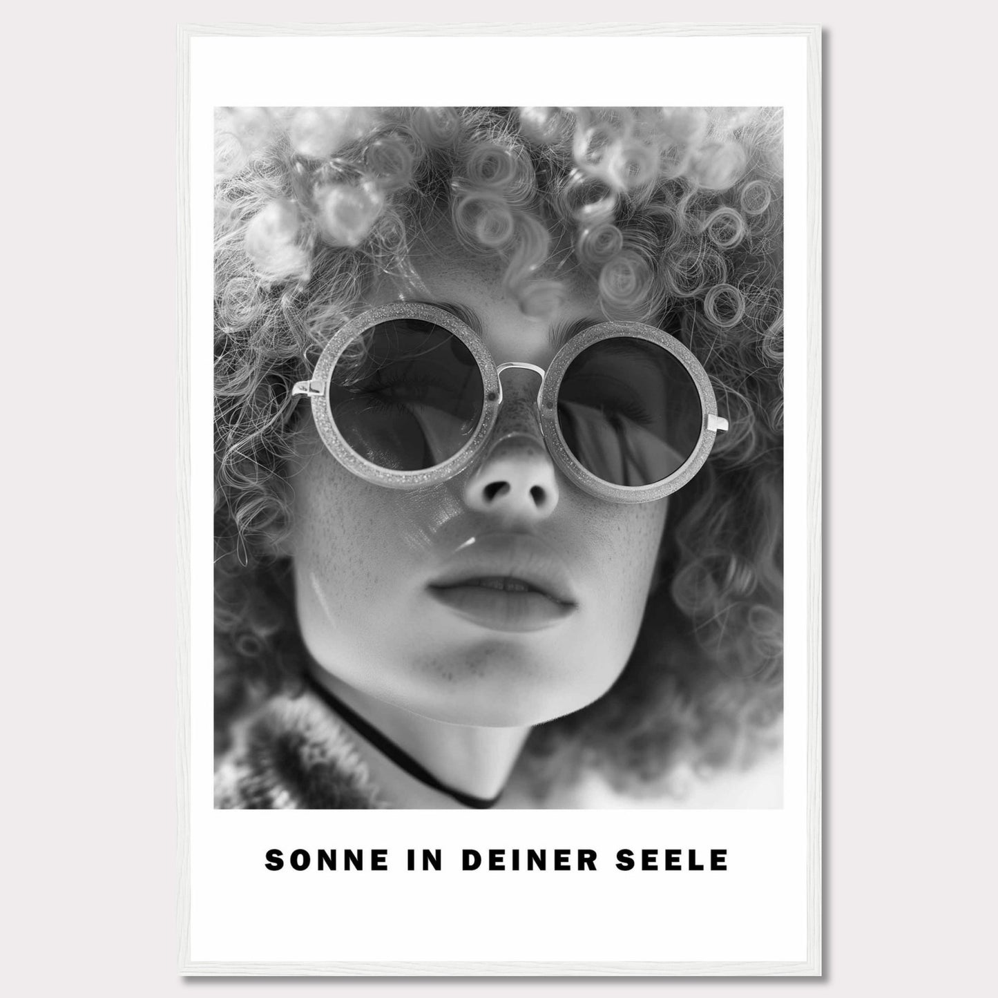 This black-and-white poster features a close-up of a person with curly hair wearing round sunglasses. The text at the bottom reads "SONNE IN DEINER SEELE," which translates to "Sun in Your Soul."