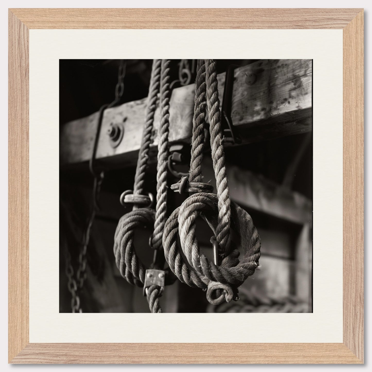 This black and white illustration depicts a close-up view of coiled ropes hanging from wooden beams, evoking a rustic or nautical theme.