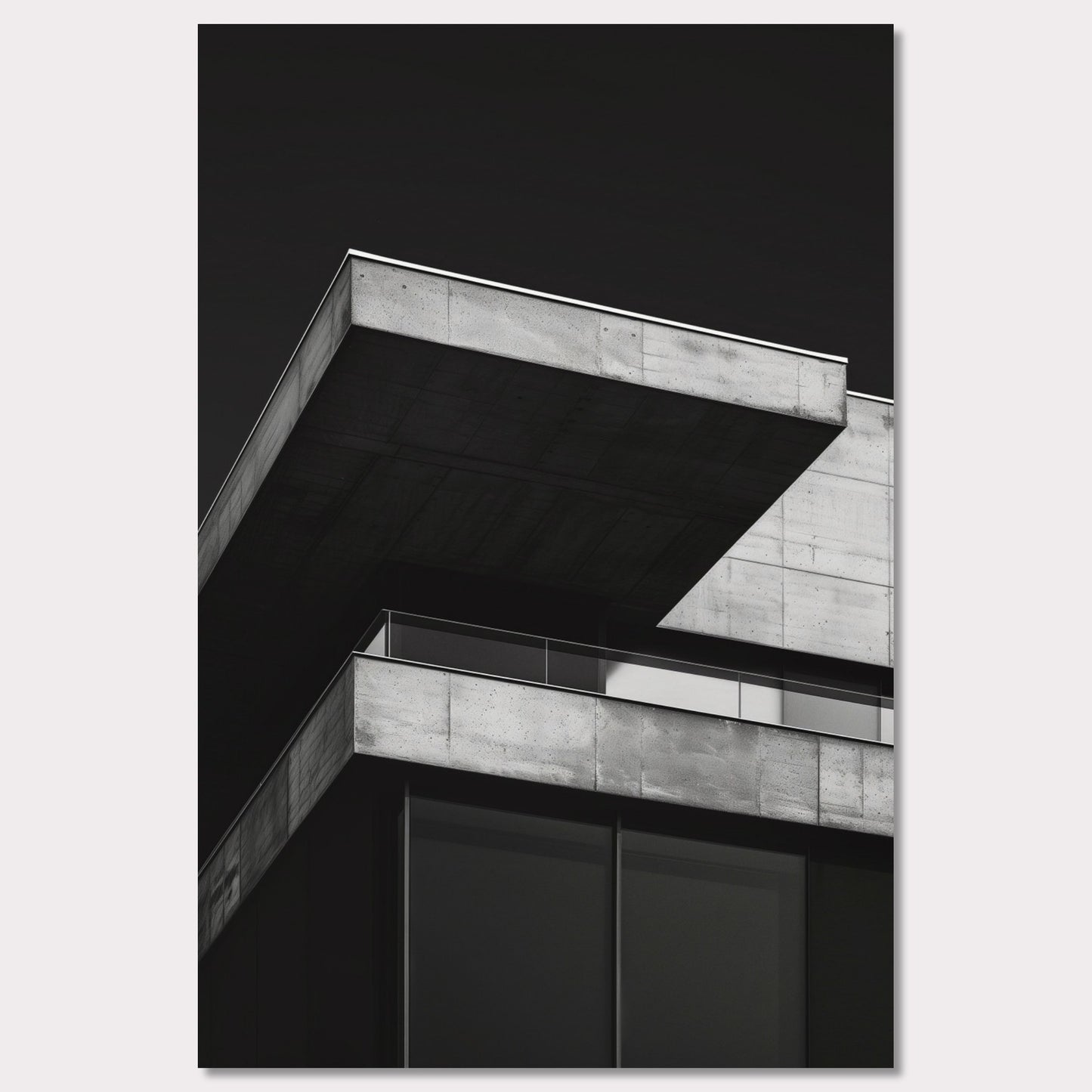 This striking black and white photograph captures the modern architectural lines of a concrete building against a dark background. The image highlights the stark contrast and geometric precision of contemporary design.