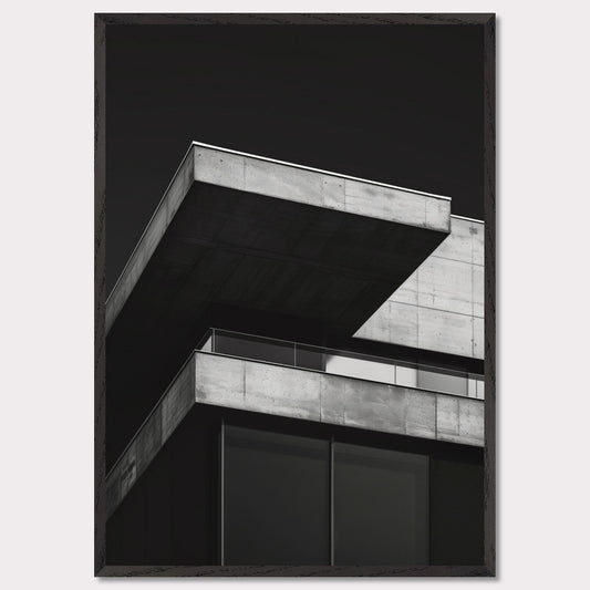 This striking black and white photograph captures the modern architectural lines of a concrete building against a dark background. The image highlights the stark contrast and geometric precision of contemporary design.