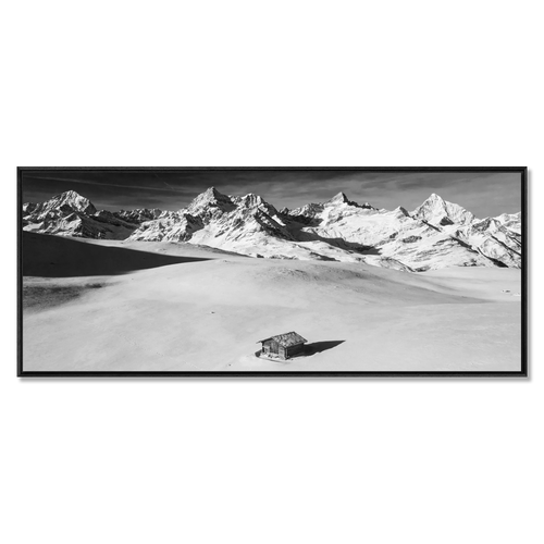 Alpine Cabin in Silence – Alu-Dibond wall art featuring a solitary cabin in vast snowfields and towering mountains.