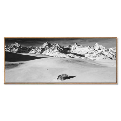Alpine Cabin in Silence – Alu-Dibond wall art depicting a solitary cabin in vast snowfields and mountains.
