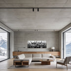 Alpine Cows Gaze – Alu-Dibond wall art displayed in modern living room with mountain view.