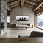 Alpine Cows Mist – Alu-Dibond wall art displayed in a modern alpine living room with wooden beams and stone fireplace.