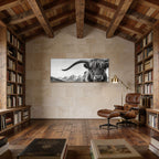 Alpine Horned Beauty – Alu-Dibond wall art showcasing a majestic cow in a cozy wood library with mountain backdrop.
