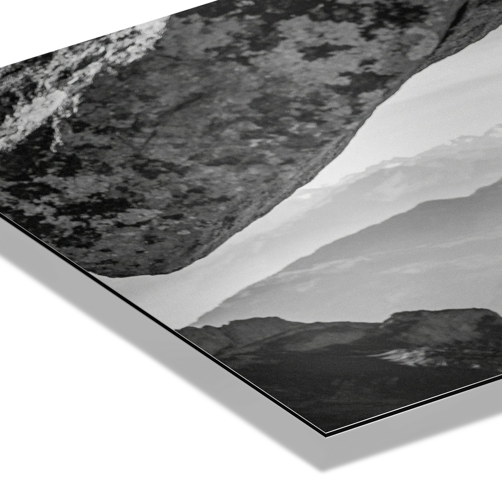 Alpine Ibex Cliff – Alu-Dibond wall art showcasing dramatic black-and-white textures of mountain cliffs and rocks.