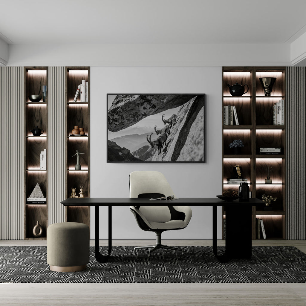 Alpine Ibex Cliff – Alu-Dibond wall art displayed in a modern office setting with stylish shelving.
