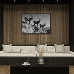Alpine Ibex Ridge – Alu-Dibond wall art featuring three ibex on a rocky ridge in a modern living room.