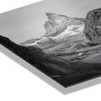 Balance of Stone – Alu-Dibond wall art featuring striking alpine rock against a dramatic mountain backdrop.