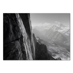 Cliff Light – Alu-Dibond wall art depicting a dramatic alpine wall and misty mountain valleys.