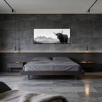 Highland Cow Peaks – Alu-Dibond wall art displayed above a modern bed in a sleek bedroom with stone walls.
