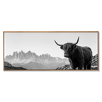 Highland Cow Peaks – Alu-Dibond wall art featuring a black-and-white Highland cow in an alpine landscape.
