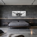 Horned Alpine Duo – Alu-Dibond wall art displayed in a modern bedroom with dark decor and stone walls.