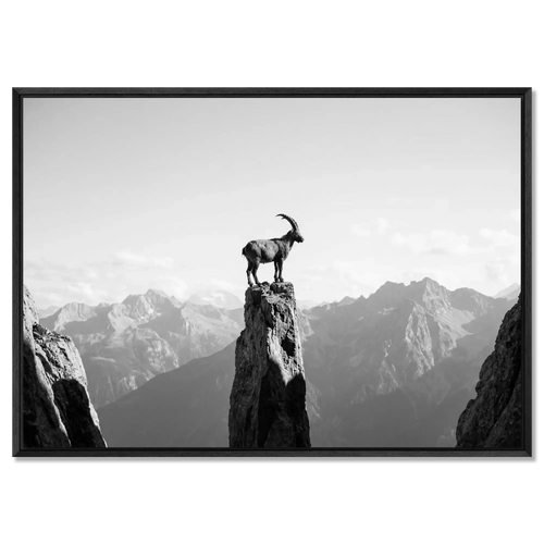 Ibex on the Edge of Silence - Large Alpine Wall Art XXL featuring a solitary ibex on a rocky pillar in black and white.