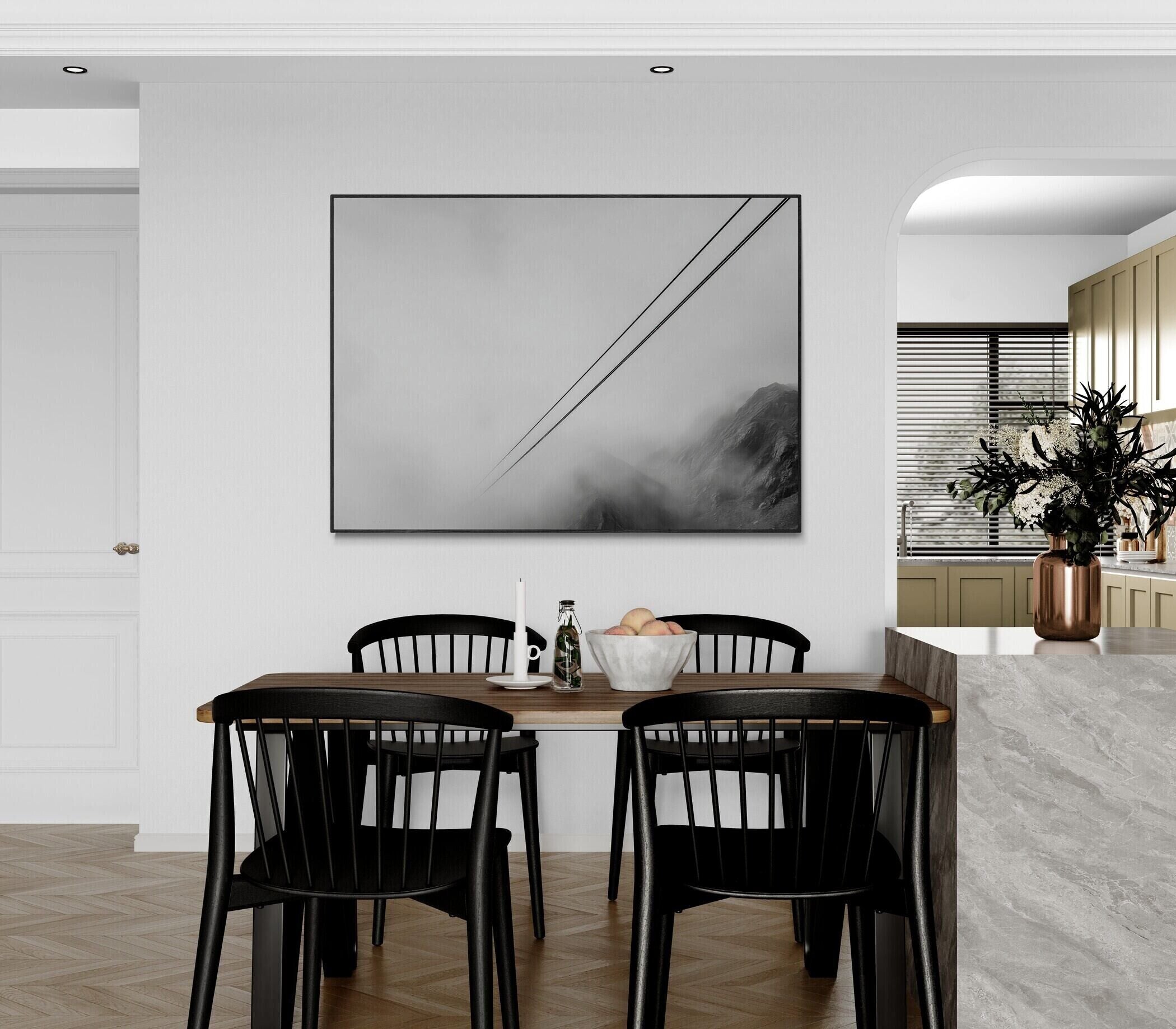 Lines Above the Alps – Alu-Dibond wall art hanging in a modern dining area with black chairs and minimalist decor.
