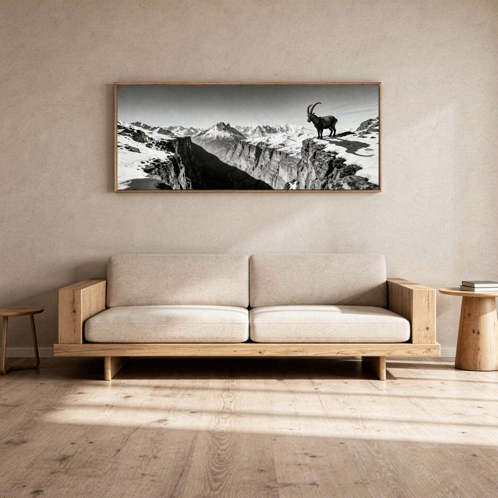 Alpine Ibex Horizon – Alu-Dibond wall art displayed above a modern sofa in a minimalistic living room.