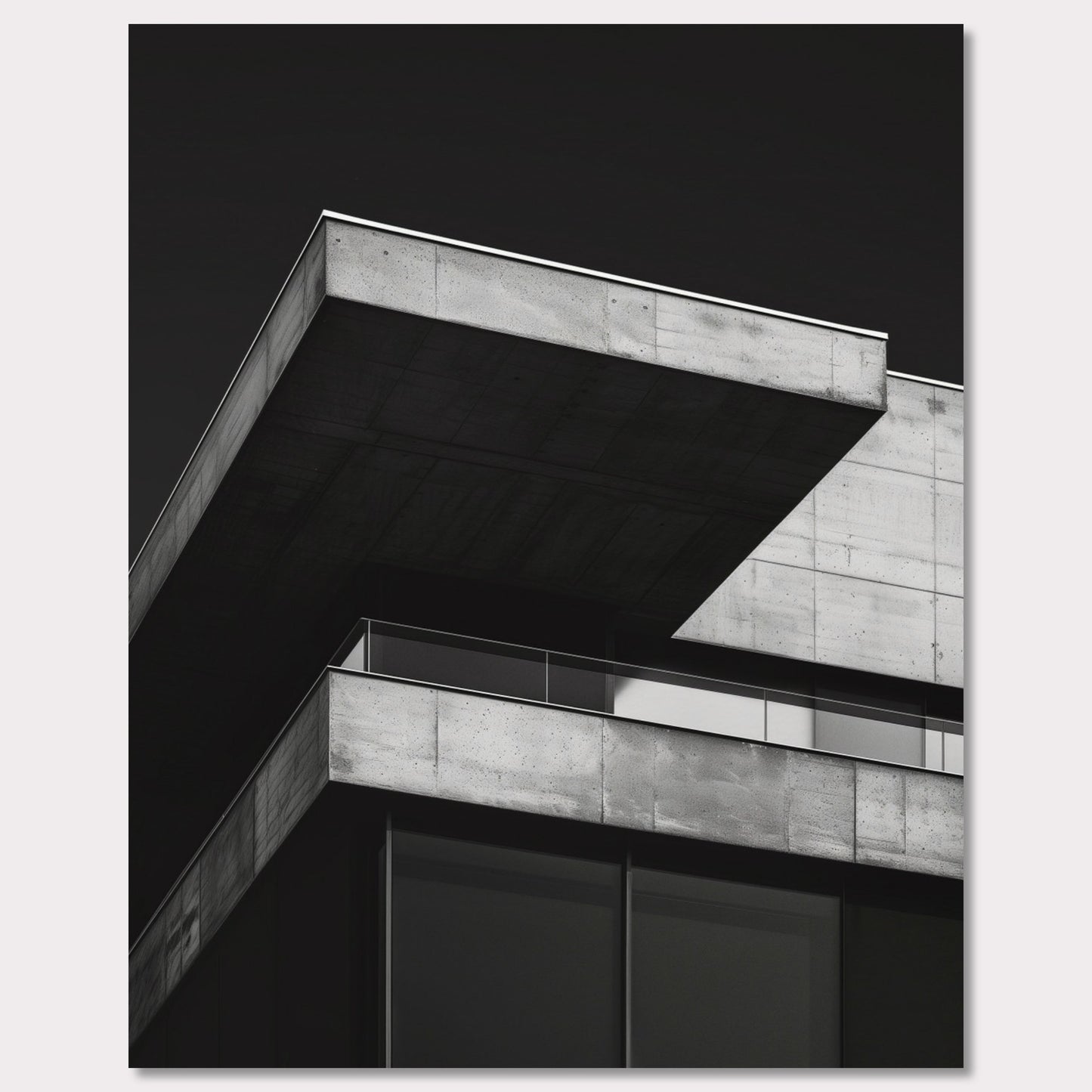 This striking black and white photograph captures the modern architectural lines of a concrete building against a dark background. The image highlights the stark contrast and geometric precision of contemporary design.