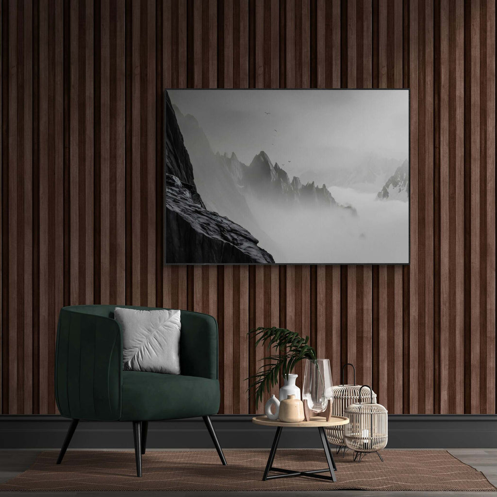 Above the Clouds – Alu-Dibond wall art displayed in a stylish interior with green chair and decorative elements.