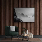 Above the Clouds – Alu-Dibond wall art displayed in a stylish interior with green chair and decorative elements.