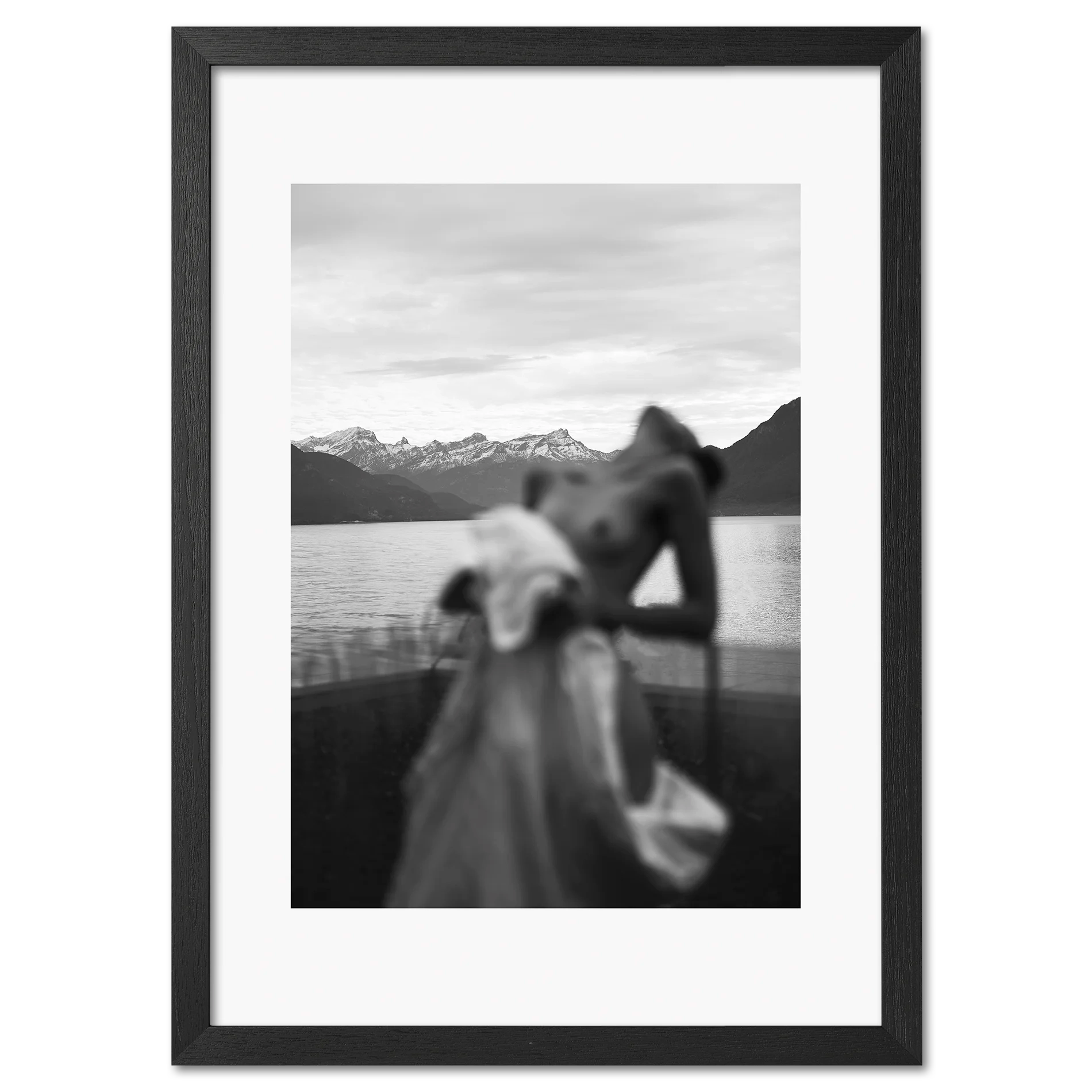 Alpine Silhouette - Poster featuring a blurred woman silhouette by a serene lake with snowy mountains.