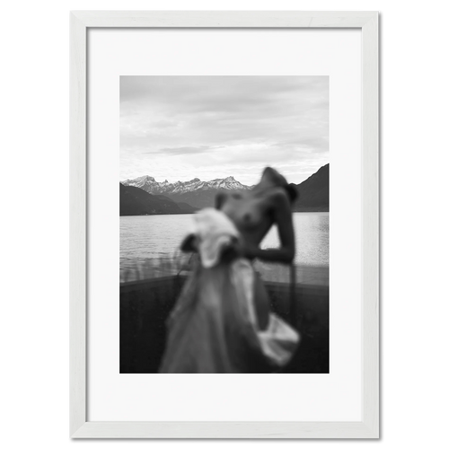 Alpine Silhouette - Poster featuring a blurred silhouette of a woman before snowy peaks and a tranquil lake.