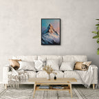 Alps Ember - Poster displayed above a modern sofa, showcasing striking alpine art in soft blue and lavender tones.