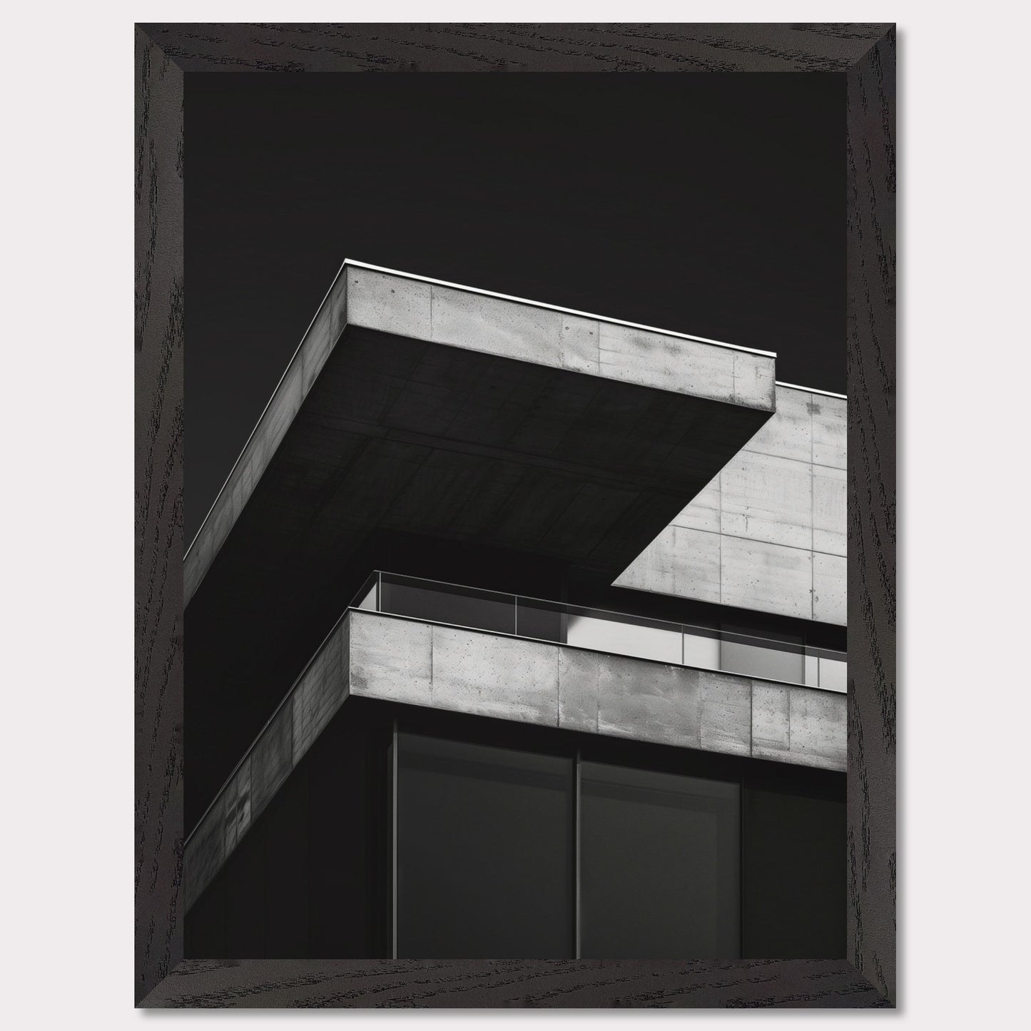 This striking black and white photograph captures the modern architectural lines of a concrete building against a dark background. The image highlights the stark contrast and geometric precision of contemporary design.