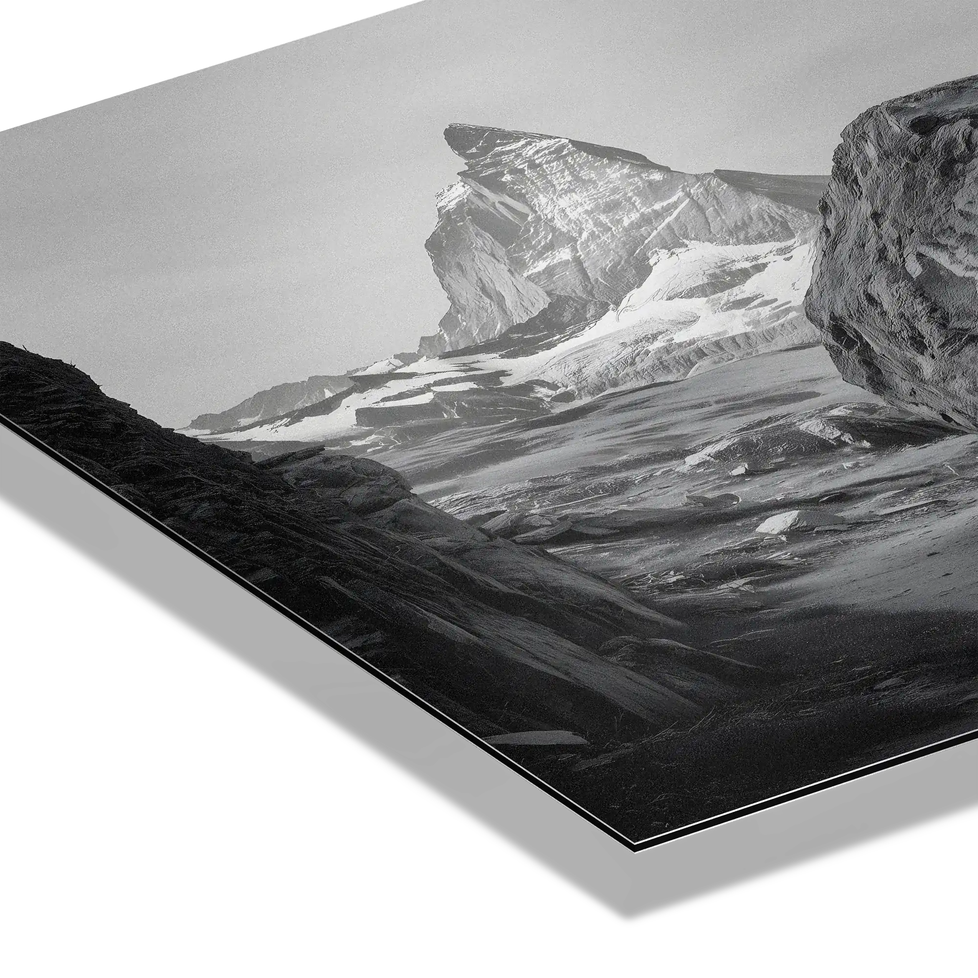 Balance of Stone – Alu-Dibond wall art featuring striking alpine rock against a dramatic mountain backdrop.