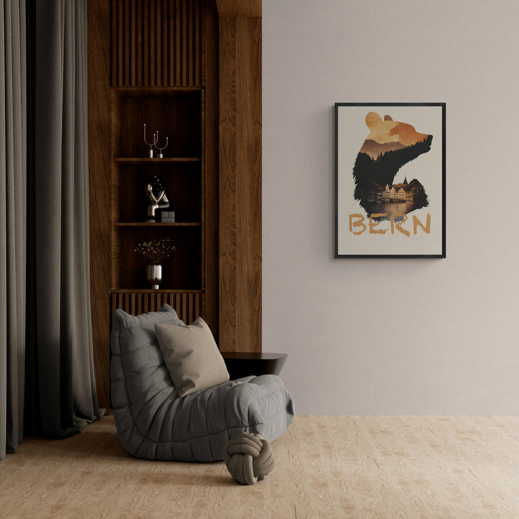 Gray armchair in a room with a wooden bookshelf and framed artwork on the wall.