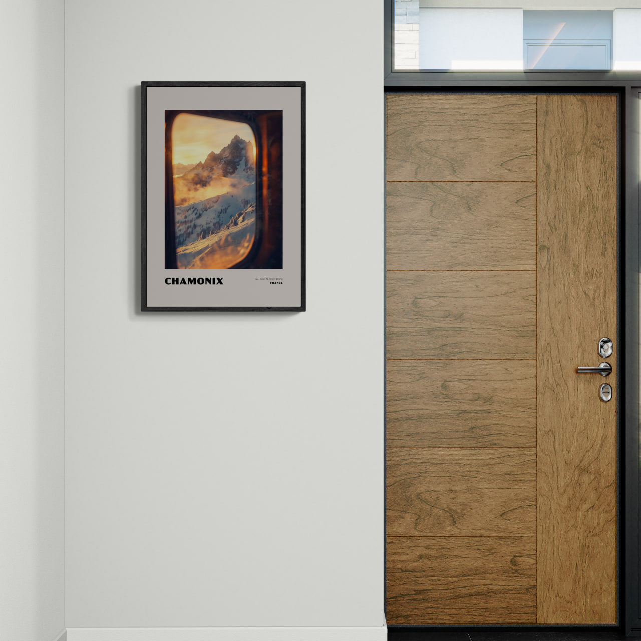 Chamonix - Gateway to Mont Blanc - Poster framed on a wall near a wooden door, showcasing snowy mountains at sunrise.