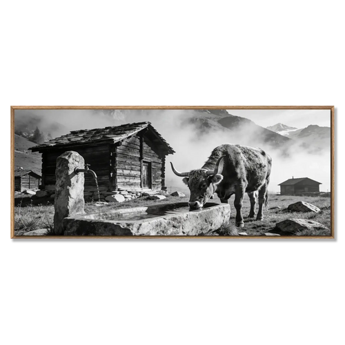 Eringer Cow in Valais drinking from a stone fountain, framed by chalets and mountains. Large Alpine Wall Art XXL.