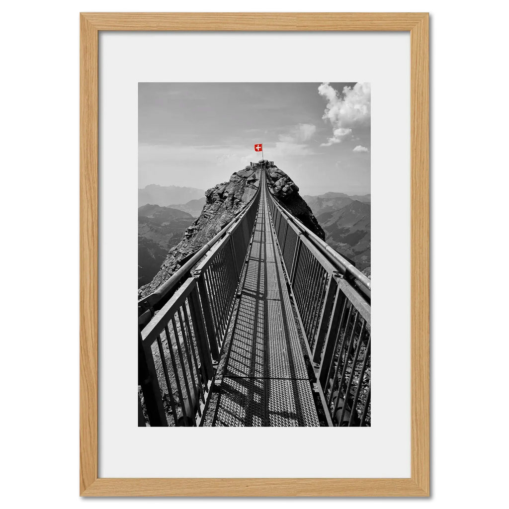 Glacier 3000 Suspension Bridge - Poster showcasing a narrow bridge with a red Swiss flag atop a rocky peak.
