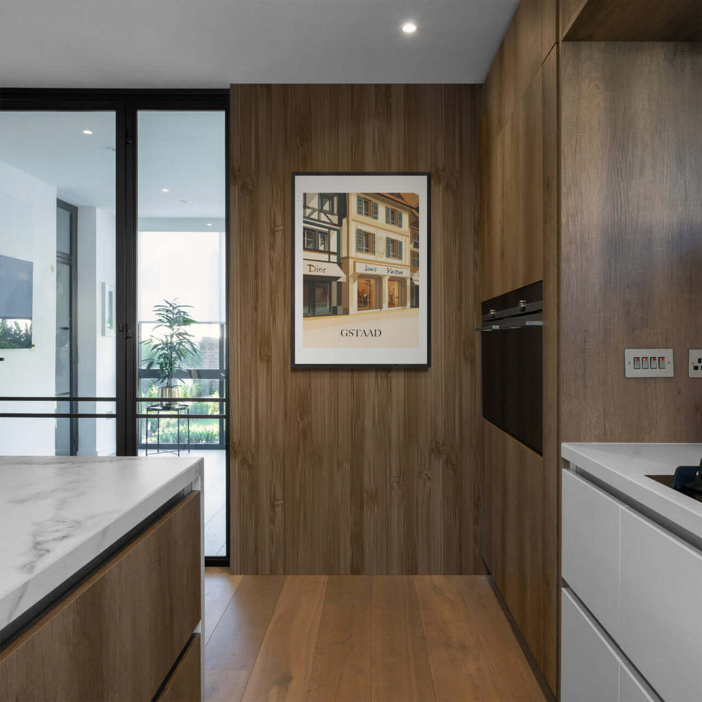 Gstaad – Luxury Shopping District - Poster displayed in a modern kitchen with wooden accents and natural lighting.