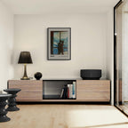 Hugs at the Hotel Window - Poster displayed in a modern minimalist living room with warm and cool tones.