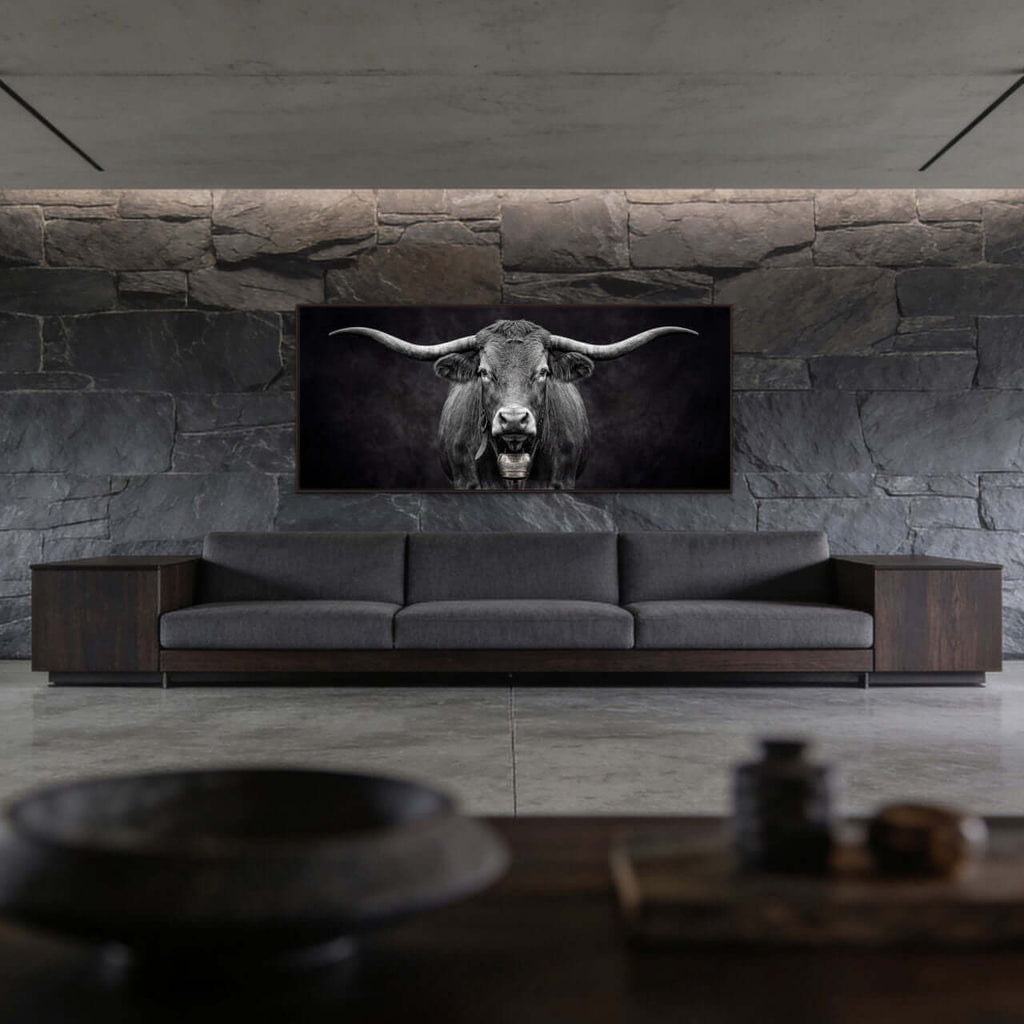 Presence of a Cow artwork featuring a Swiss cow on a wall above a modern sofa in a stylish interior.
