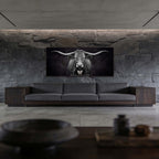 Presence of a Cow artwork featuring a Swiss cow on a wall above a modern sofa in a stylish interior.