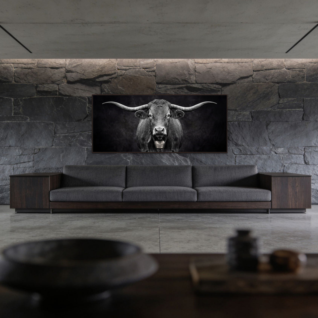 Presence of a Cow artwork featuring a Swiss cow on a wall above a modern sofa in a stylish interior.