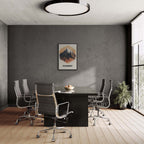 Majestic Peaks of Chamonix - Poster displayed in a modern conference room with sleek furniture.