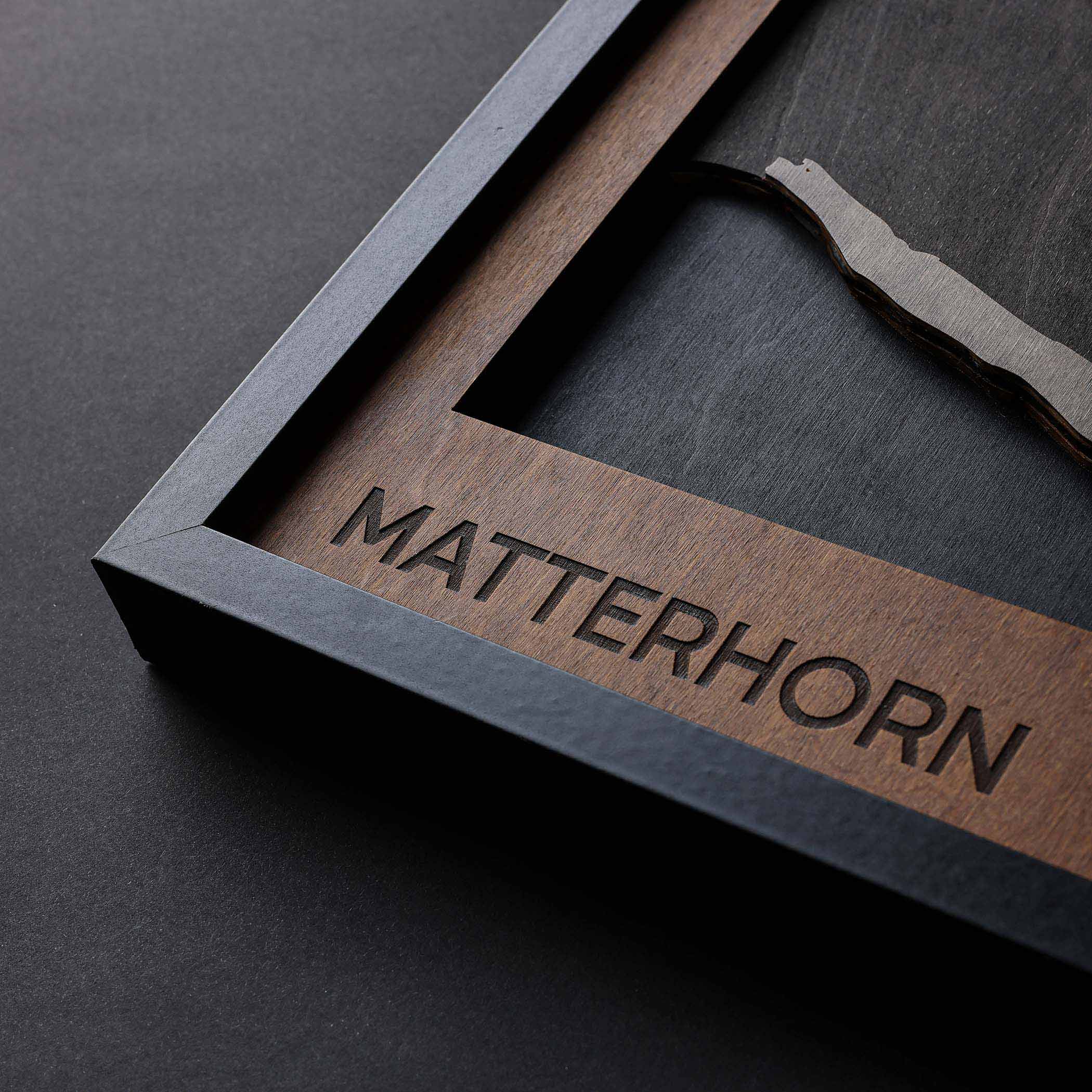 Close-up of Matterhorn: Multilayered Plywood Artwork framed, showcasing its intricate design and natural wood textures.