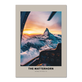 Aerial view of The Matterhorn at sunrise from a cockpit, featuring dramatic lighting and snowy peaks.