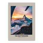 Aerial view of The Matterhorn at sunrise from a cockpit, featuring dramatic lighting and snowy peaks.