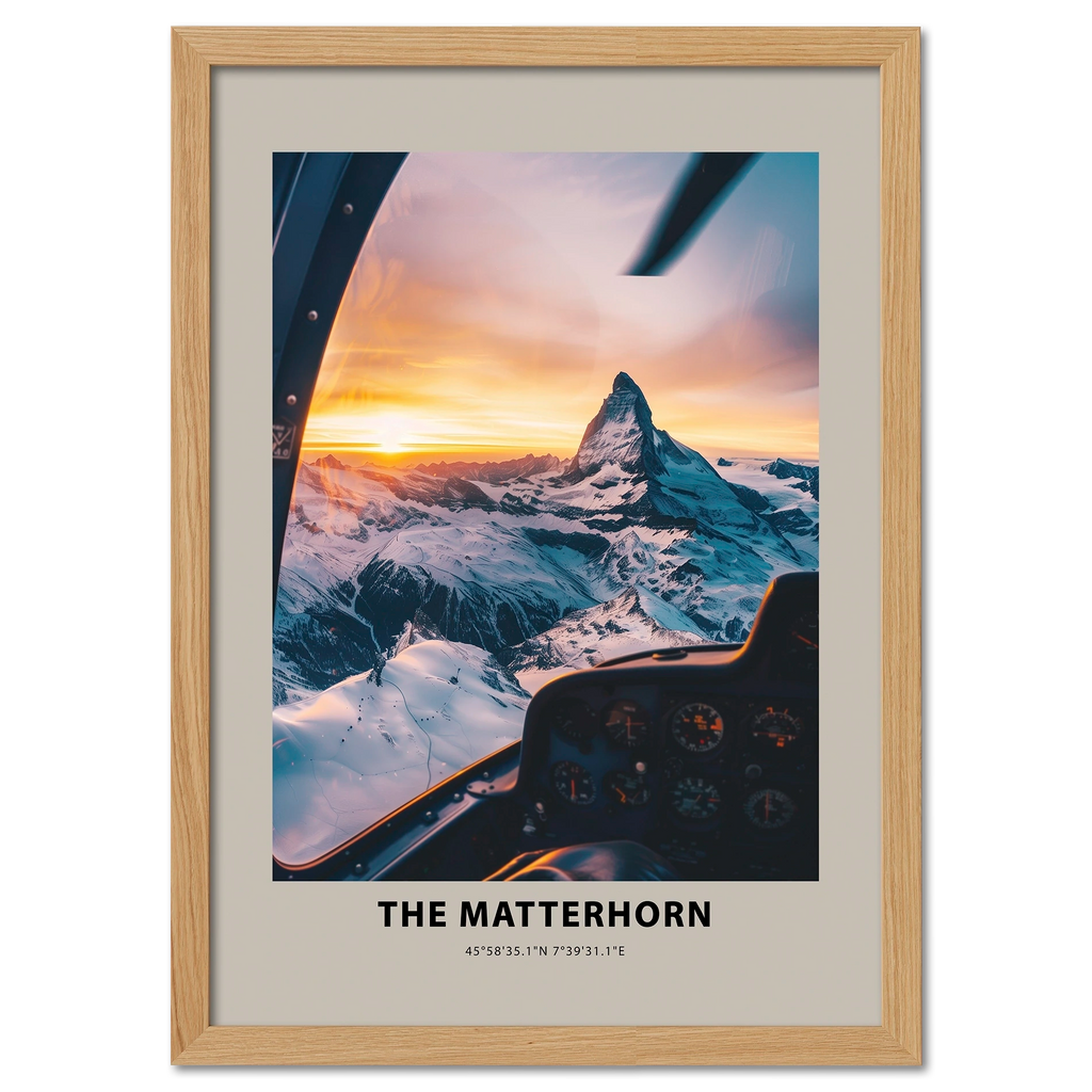 Aerial view of The Matterhorn at sunrise from a cockpit, showcasing snowy peaks and warm golden light.