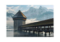 Moment in Luzern - Poster featuring Kapellbrücke and Water Tower with misty Alps in the background, ideal wall art.