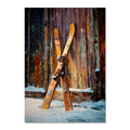 Old Skis, Alpine Shed - Poster: A pair of old wooden skis leaned against a rustic shed in falling snow.
