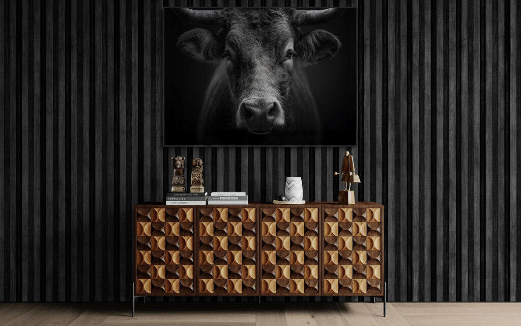 Presence of a bull - Alu-Dibond wall art displayed above a stylish wooden cabinet in a modern interior.