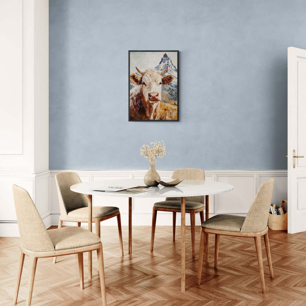 Queen of Zermatt_Poster_black_frame - Poster displayed in a modern dining room with wooden chairs and blue walls.