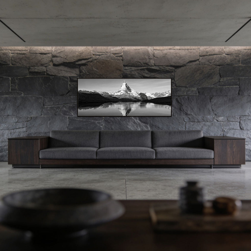 Reflection of the Matterhorn – Alu-Dibond wall art displayed above a modern gray sofa in a stylish interior.