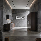 Silent Route to the Matterhorn – Alu-Dibond wall art displayed in a modern kitchen with stone walls and wooden cabinetry.