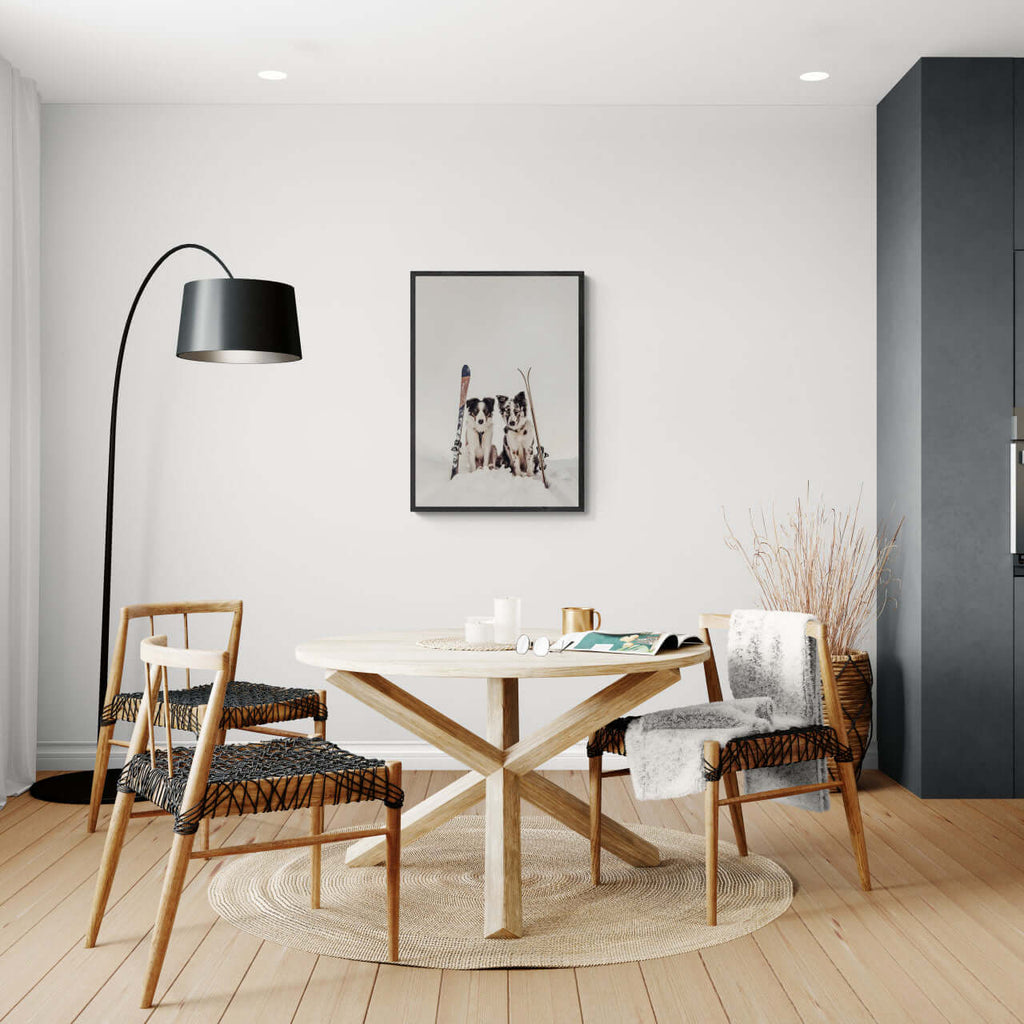 Ski Dogs - Poster displayed in a modern dining area, showcasing wall art with vintage skis and attentive dogs.